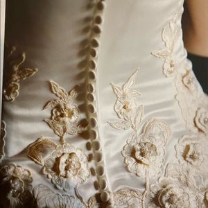 Beautiful wedding gown, worn once, professionally cleaned and preserved.